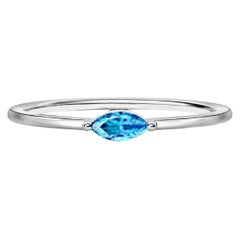Anello di fidanzamento con topazio taglio marquise East West.
