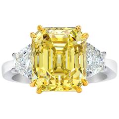 GIA Certified Fancy Yellow 7.38 Carat Emerald Cut Diamond Three-Stone Ring 10