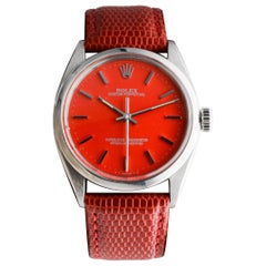 Rolex Edelstahl Oyster Perpetual mit rotem Zifferblatt circa 1970er Jahre