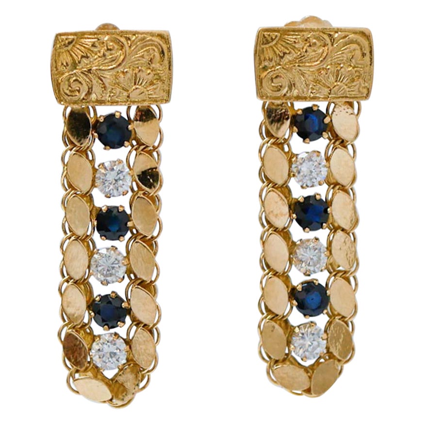 Pietre bianche e blu, orecchini in oro giallo 18 carati.