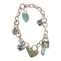 Tiffany & Co 18 Karat Gelbgold und Sterlingsilber Charm-Armband 78.7 g