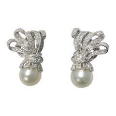 Diamond and Pearl Earrings In Platinum.