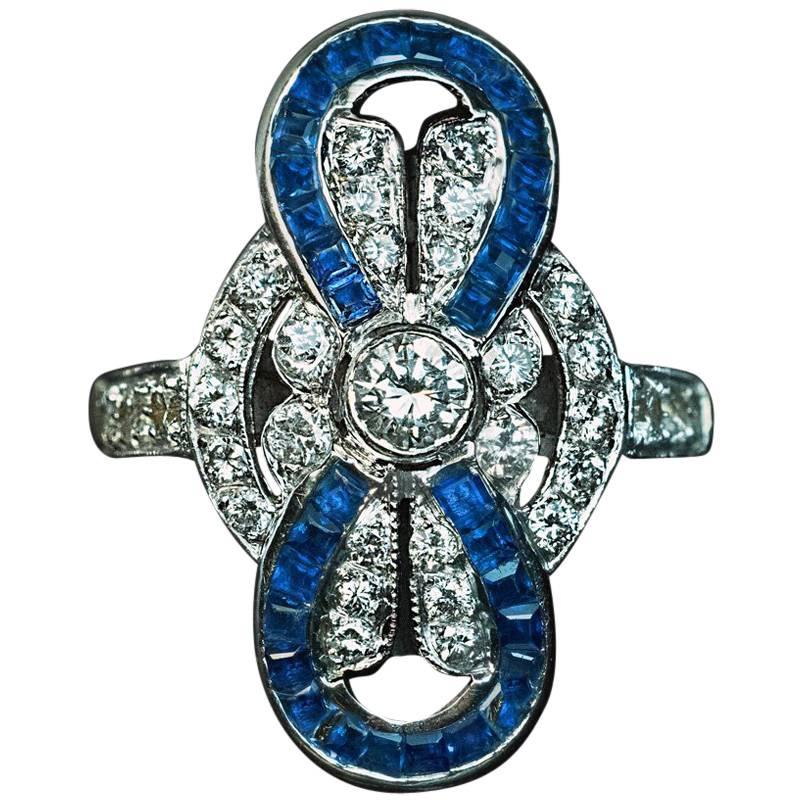 Mid Century Diamond Calibre Cut Sapphire Bow Ring For Sale