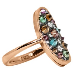 Bague en or rose avec pavé et diamant blanc, bleu Brown et violet, sertis à l'envers