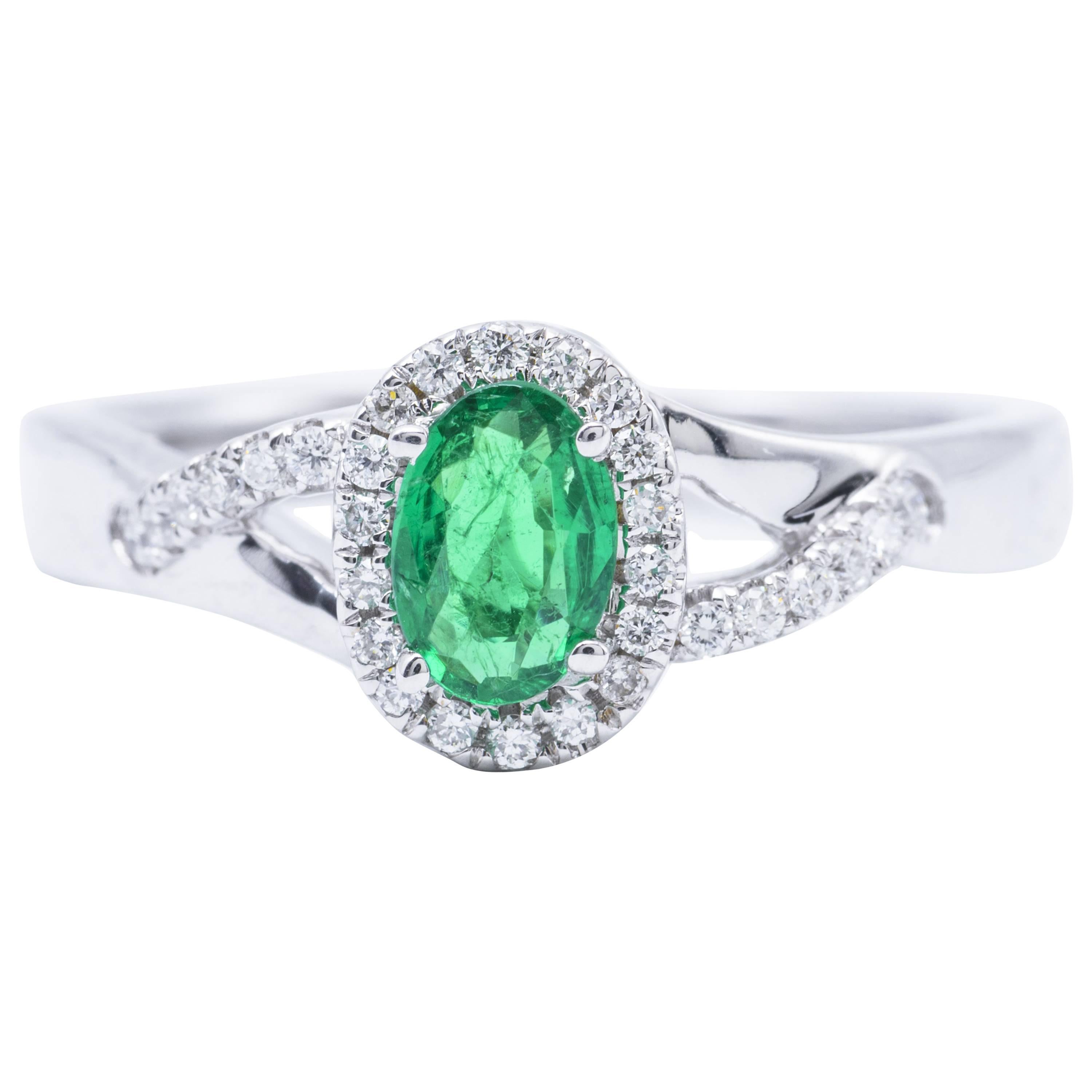 Emerald and Diamond Halo Engagement Ring