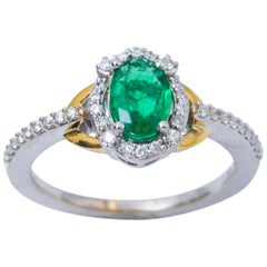 Oval Emerald and Diamond Halo White and Yellow Engagement Ring