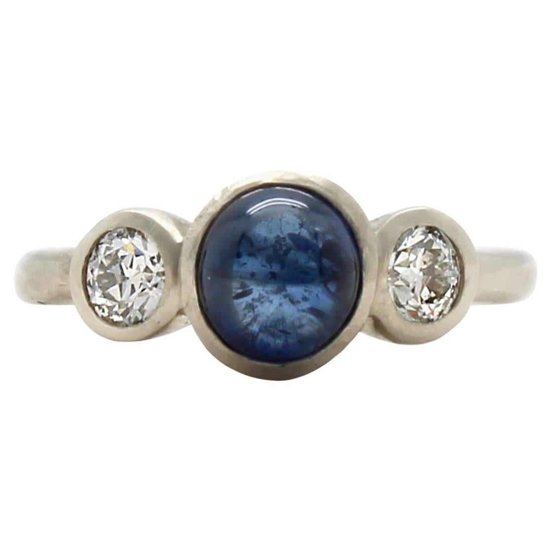 Blue Sapphire Cabochon European Cut Diamond Three Stone White Gold Ring For Sale