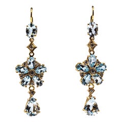 Orecchini a fiore in stile Art Nouveau con diamante bianco taglio pera e acquamarina in oro giallo
