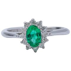 Oval Shape Emerald and Diamond Halo Engagement Ring