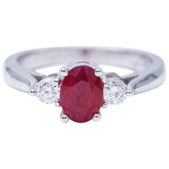 Oval Shaped 1.25 Carat Ruby Diamond White Gold Three Stone Engagement Ring