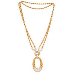1970s Boucheron Gold and Diamond Twist Pendant Necklace 1970s Boucheron Gold and Diamond Twist Pendant Necklace