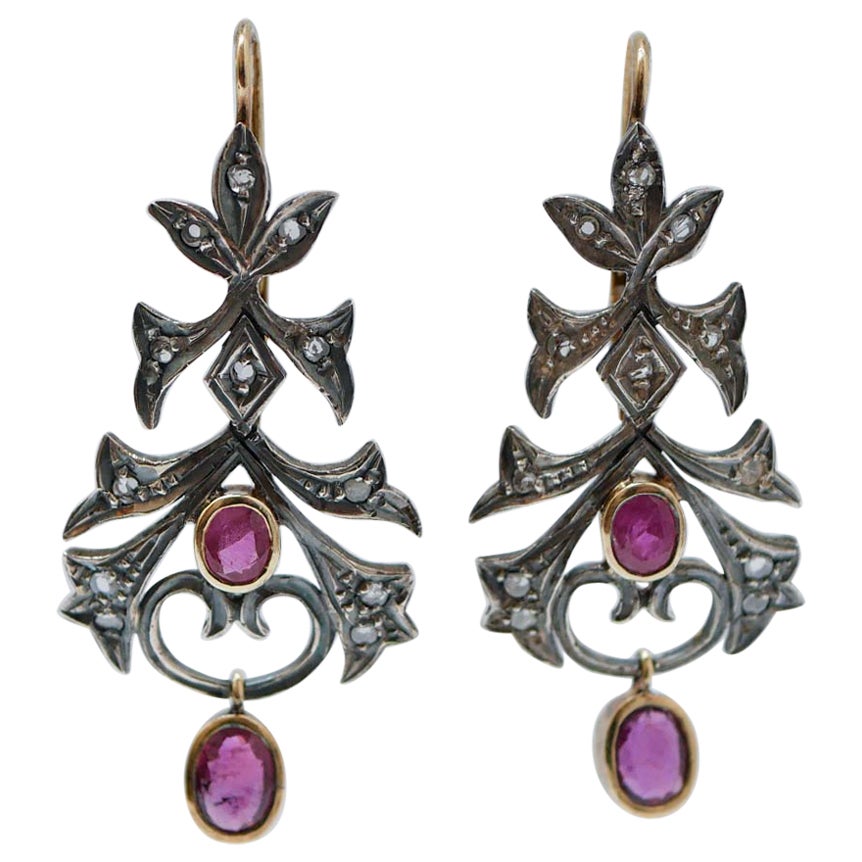 Rubine, Diamanten, 18 Kt  Ohrringe aus Roségold und Silber.