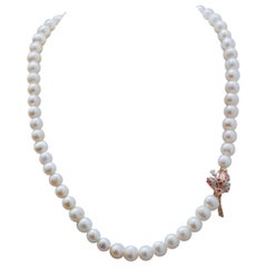 Collar de perlas, rubíes, esmeraldas, diamantes y cuentas de oro rosa y plata.