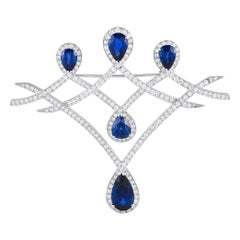 Broche en or blanc 18 carats avec diamants et saphirs de 3,87 carats