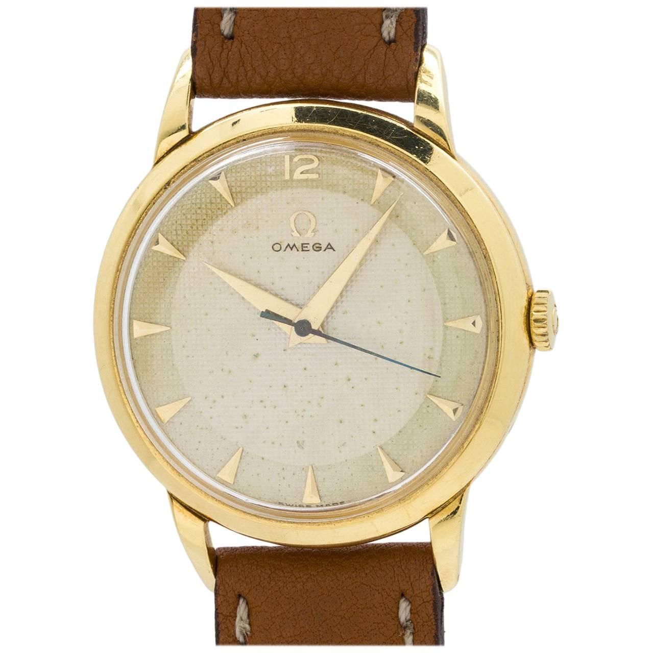 Omega  Yellow Gold Dress Model Textured Dial Manual Wristwatch circa 1950s For Sale