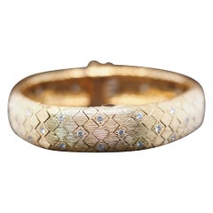 1950s Tiffany & Co. 18K Gold and Diamond  “Peek A Boo” Hidden Watch Bracelet
