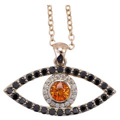Mal de Ojo Oro Amarillo 14 Kilates Diamantes Negros y Zafiro Naranja