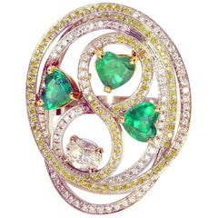 Tourbillon Ring in 18K White Gold Set With Emeralds and Diamonds