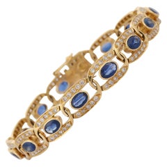 Pulsera de tenis con diamantes y zafiro azul talla oval de 11,5 quilates en oro amarillo de 18 quilates