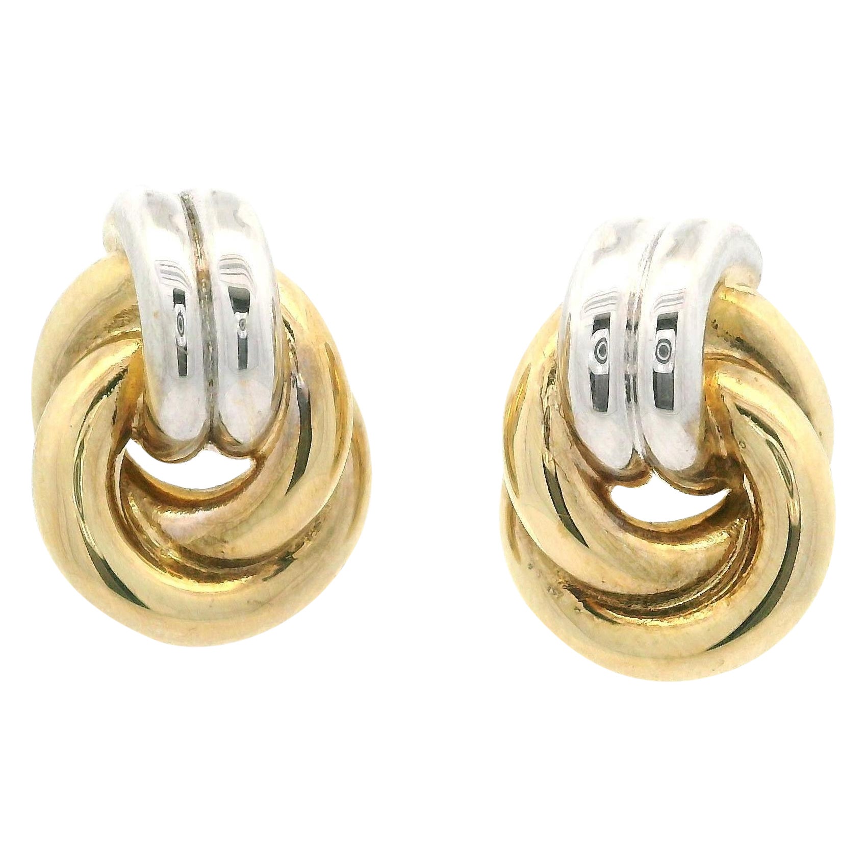 Orecchini con nodo a tubo in oro 18k bicolore, eleganti e lucidi, con chiusura a farfalla