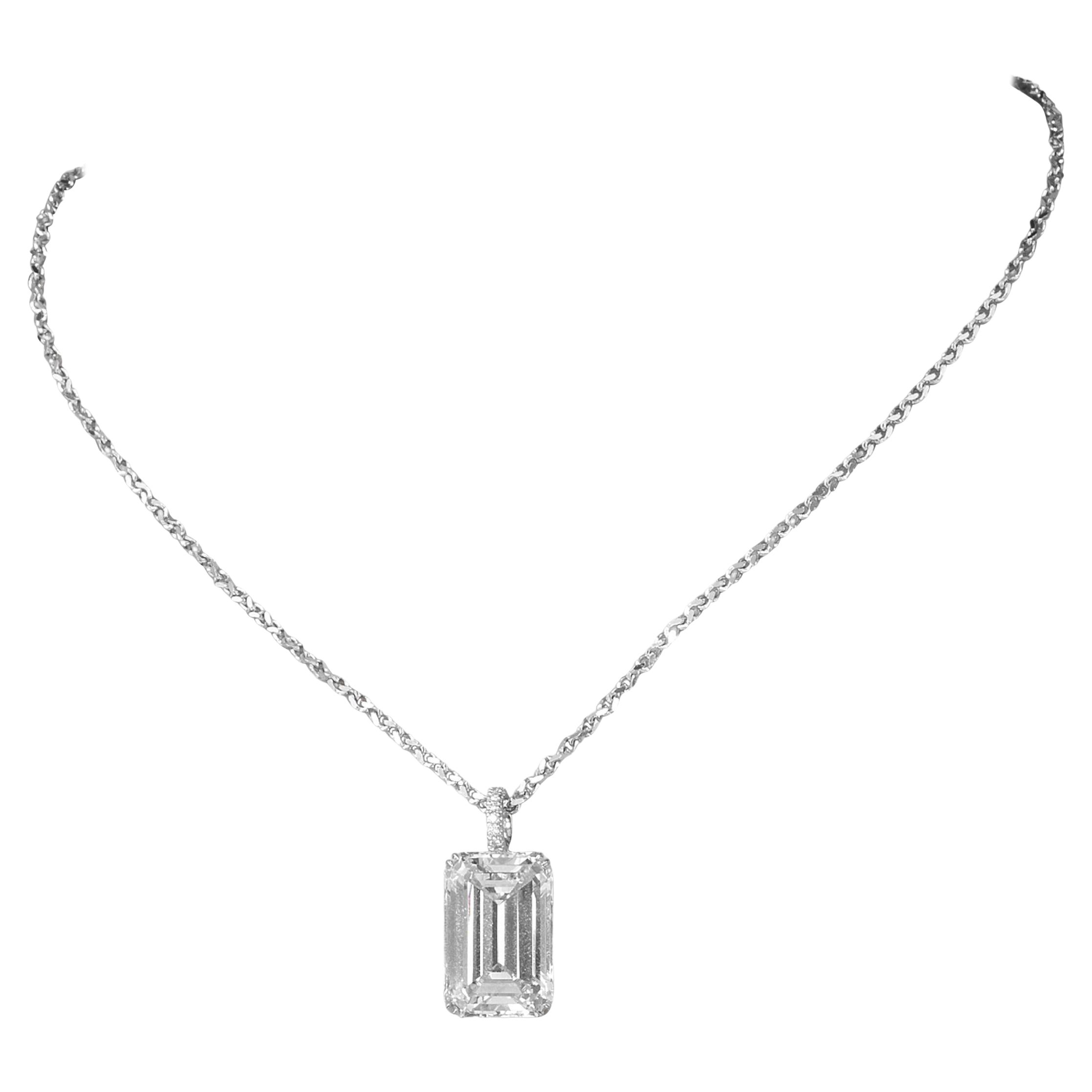 Introducing a breathtaking natural emerald cut diamond, certified by GIA  weighing an impressive 6 carats. This gem showcases a remarkable spread, enhancing its visual presence and allure. Set on a luxurious platinum pendant, this exquisite piece is
