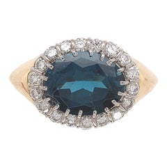 Anillo de platino y oro amarillo de 18 quilates con topacio azul turquesa y diamantes talla 6
