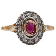 Anillo de rubí, diamantes, oro rosa de 14 quilates y plata.