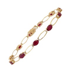 Einzigartiges Tennisarmband aus 14 Karat massivem Gelbgold mit tiefrotem Rubin und Diamanten