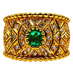 Anello da cocktail in oro giallo con diamante bianco e smeraldo taglio ovale in stile Art Deco