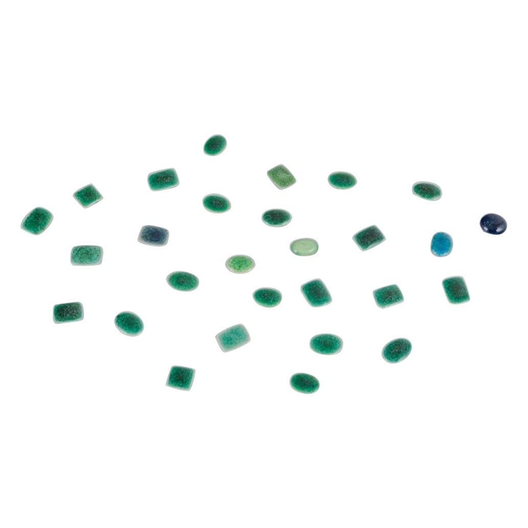 Ole Bjørn Krüger. 28 unique brooches in glazed stoneware in green shades.