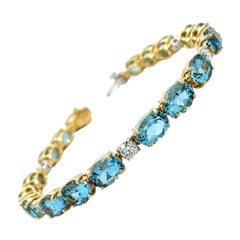 Bracciale tennis con acquamarina e diamanti in oro 18 carati, 20,99 carati totali
