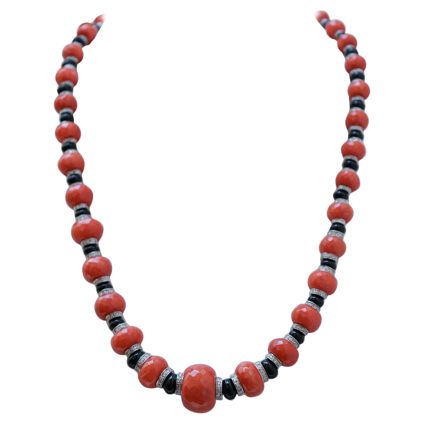 Coral, Onyx, Diamonds, 18 Kt White Gold, 14 Kt White Gold and 9 Kt White Gold.