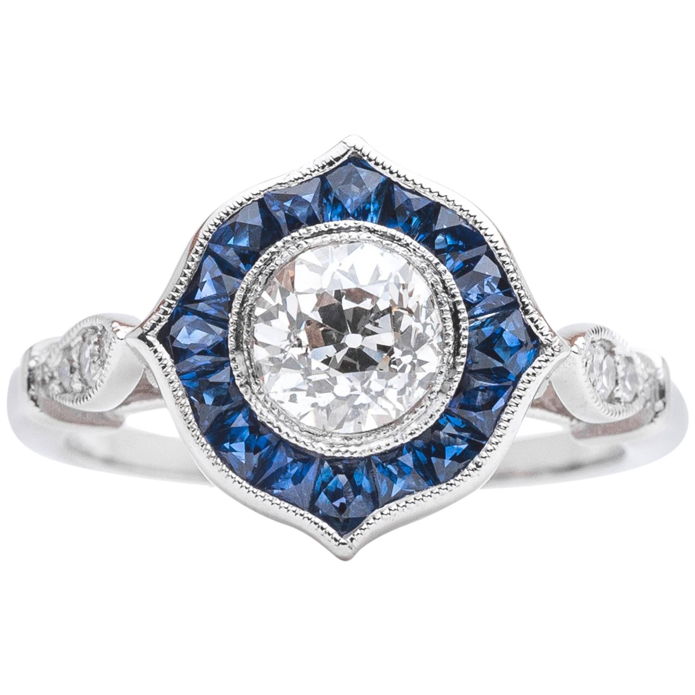 Sparkling 0.86 Carat Diamond and Sapphire Halo Ring in Platinum For Sale
