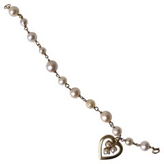 Vintage Pearl and 14 Karat Gold Heart Charm Bracelet