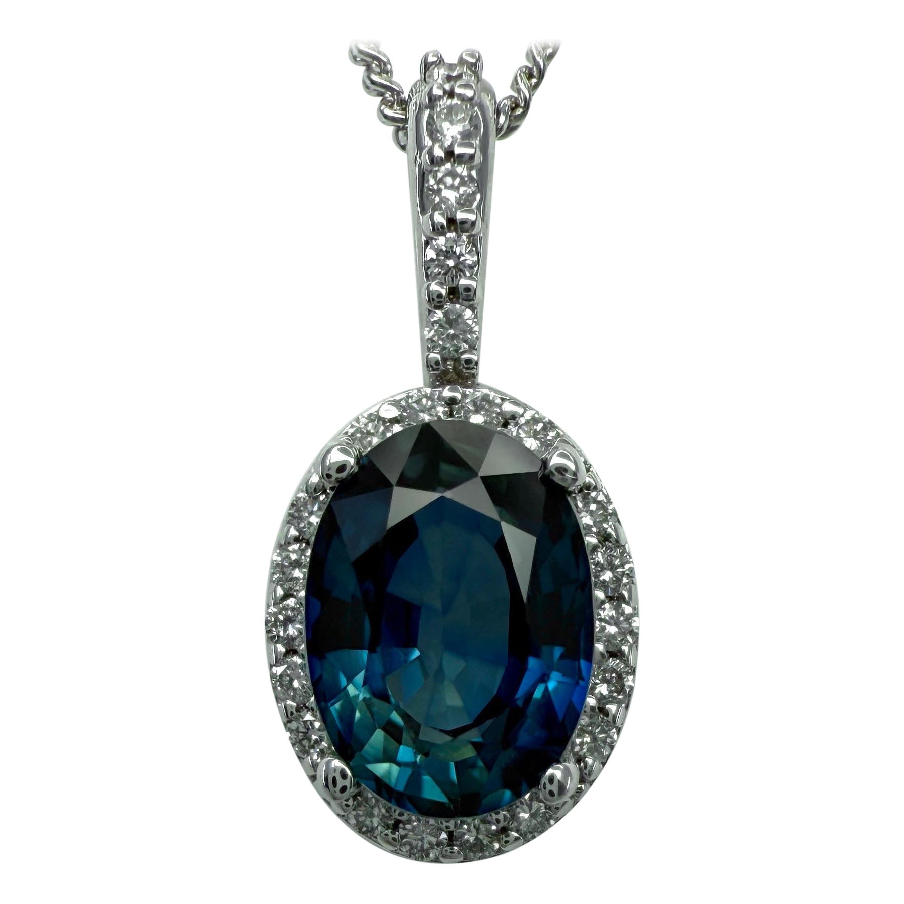 1.23ct Vivid Blue Oval Cut Sapphire And Diamond 14k White Gold Halo Pendant