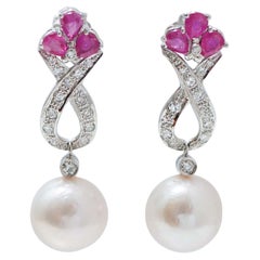 14 Mm White Pearls, Rubies, Diamonds, Platinum Earrings.