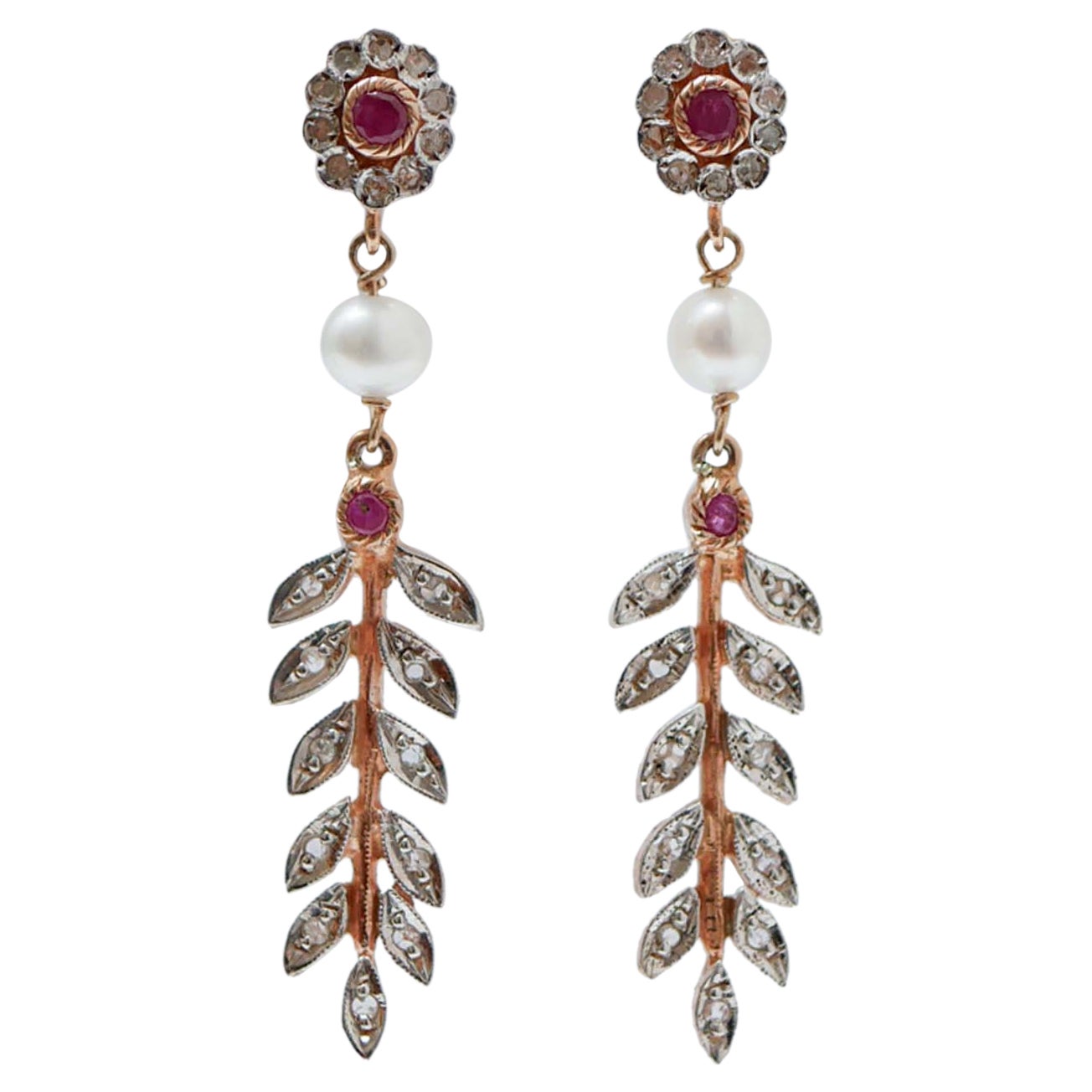 Pendientes de rubíes, diamantes, perlas, oro rosa y plata.