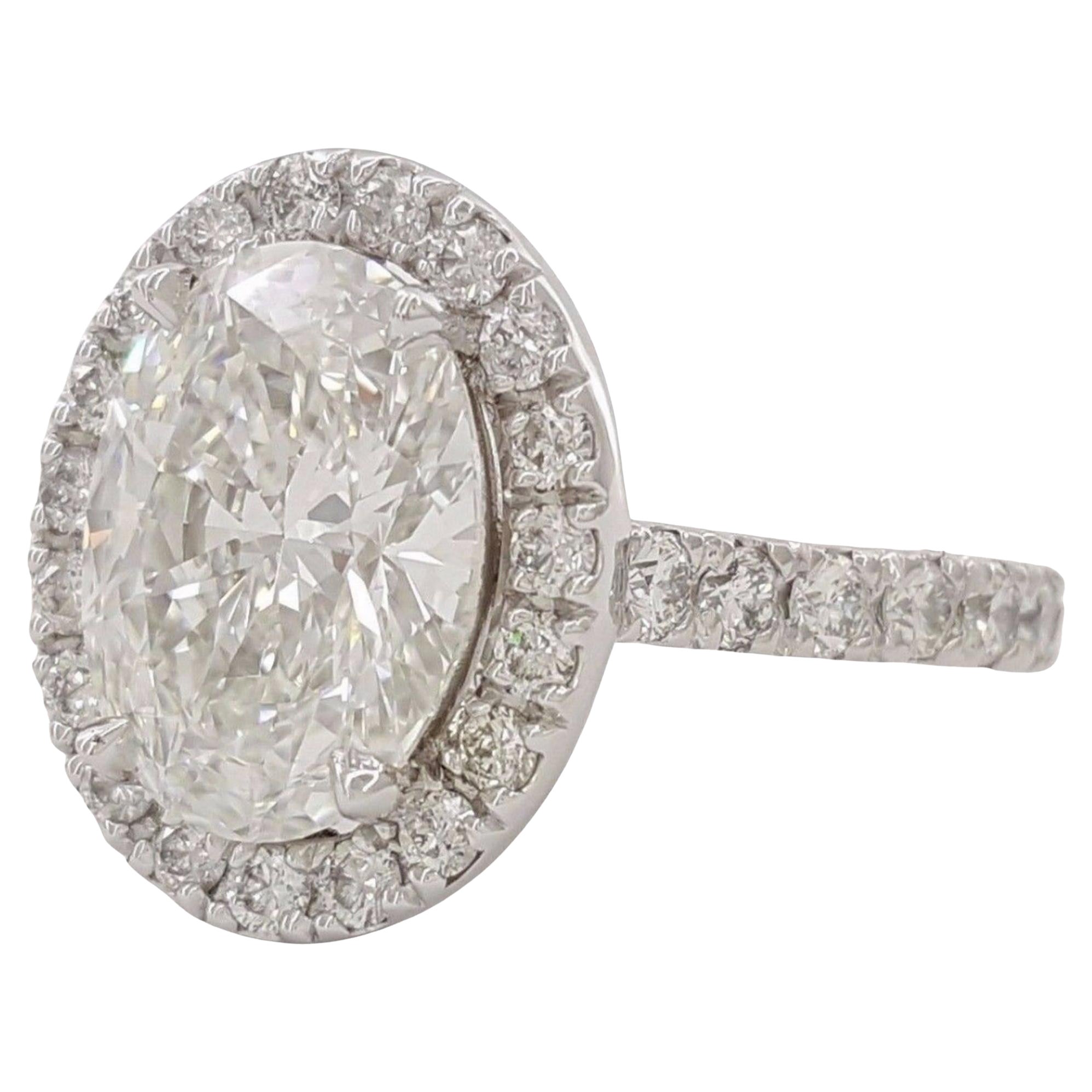 GIA Certified 3.01 Carat Oval Cut Diamond Ring with Halo and Pavè in Platinum