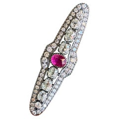 Alfiler broche de oro de 18 quilates con rubíes y diamantes