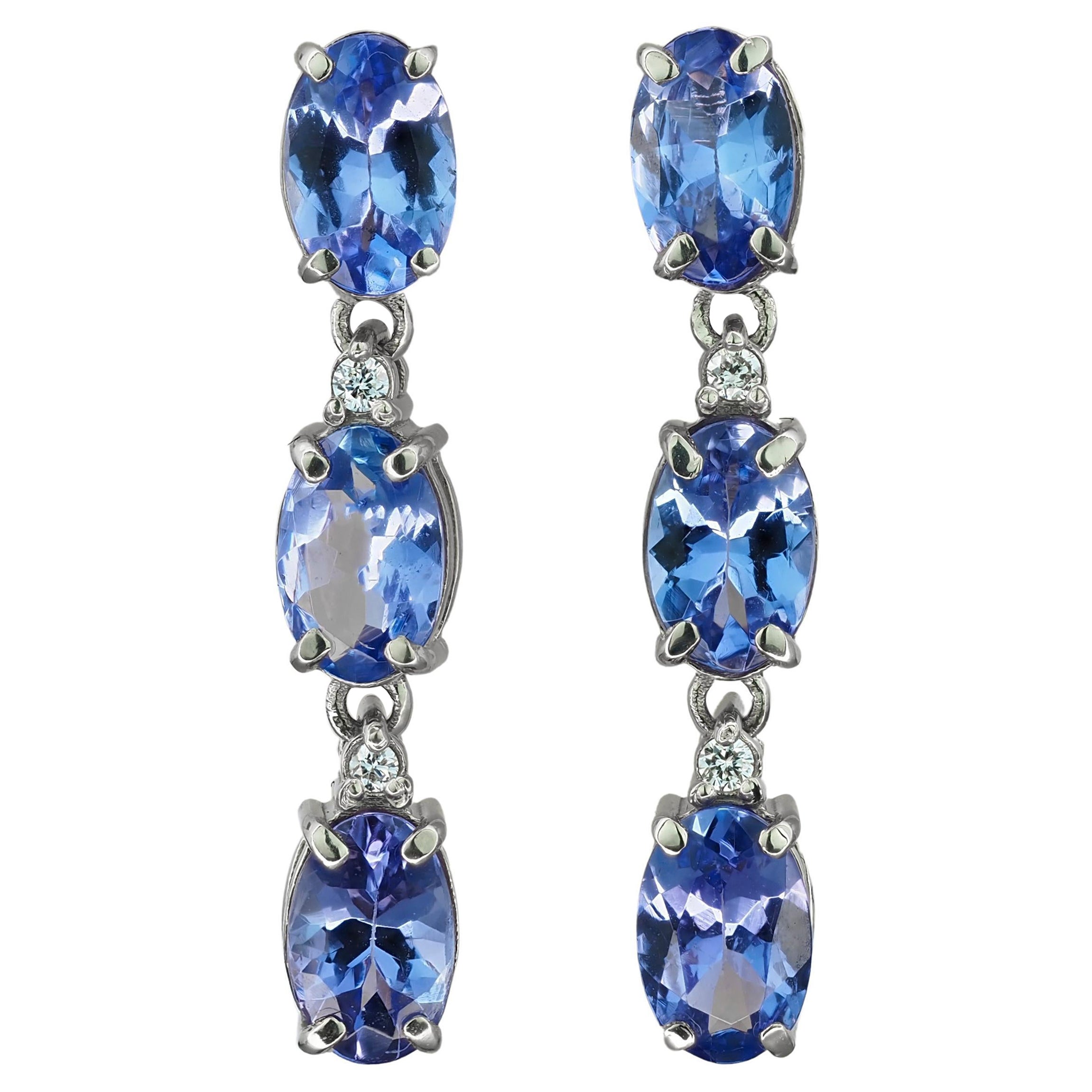 Tanzanite, diamonds 14k gold earrings studs