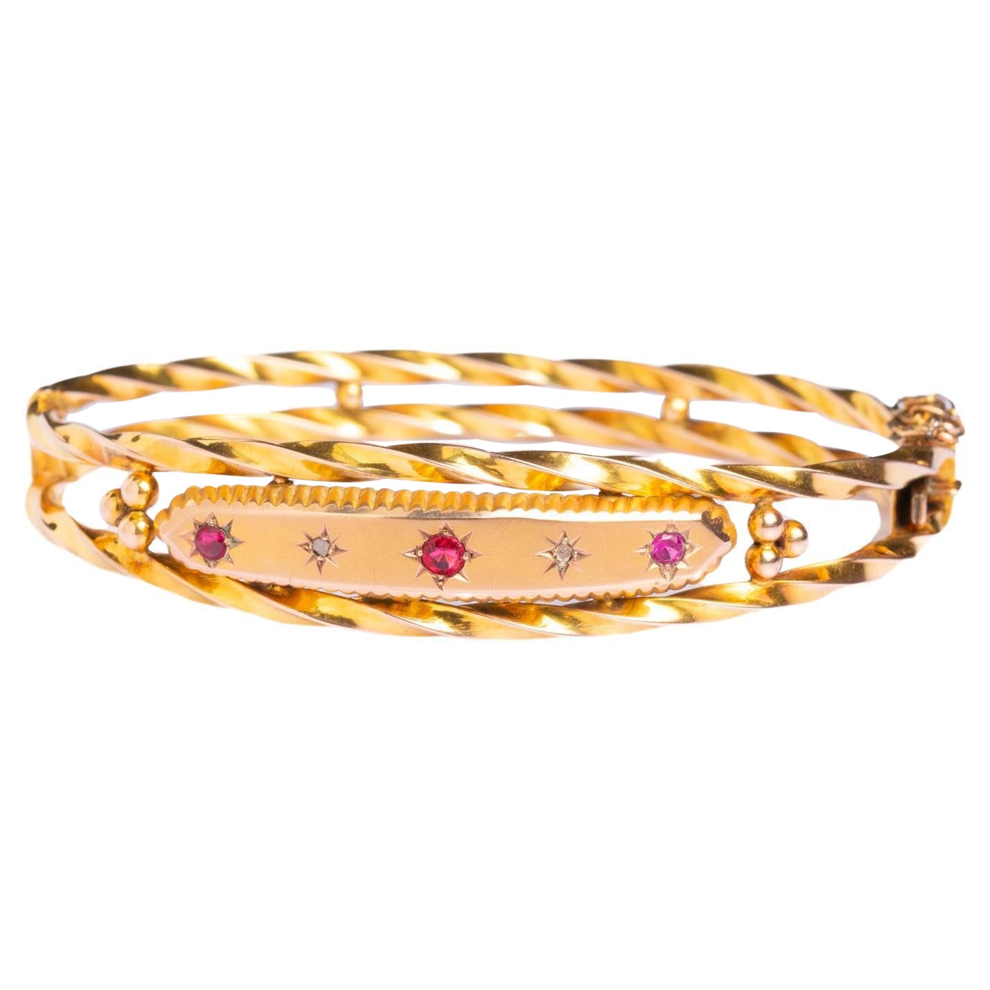 Antiker edwardianischer Starburst-Armreif aus 9 Karat Gold mit Diamanten und Rubinen im Angebot