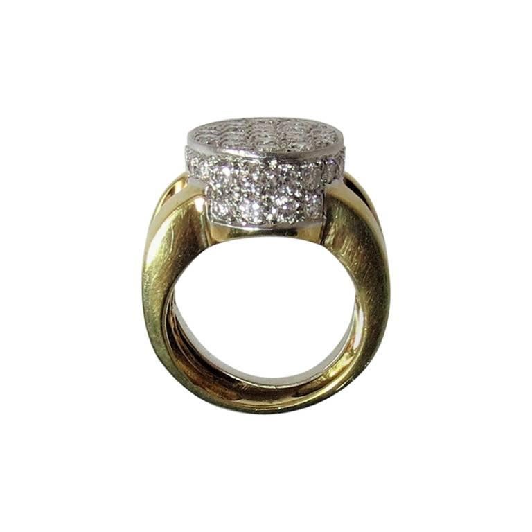 18k yellow gold wide diamond pave ring, oval design, paved on top and around sides, pave set with 53 full cut round diamonds weighing 2.70 cts., split shank
Finger size 6.5, may be sized