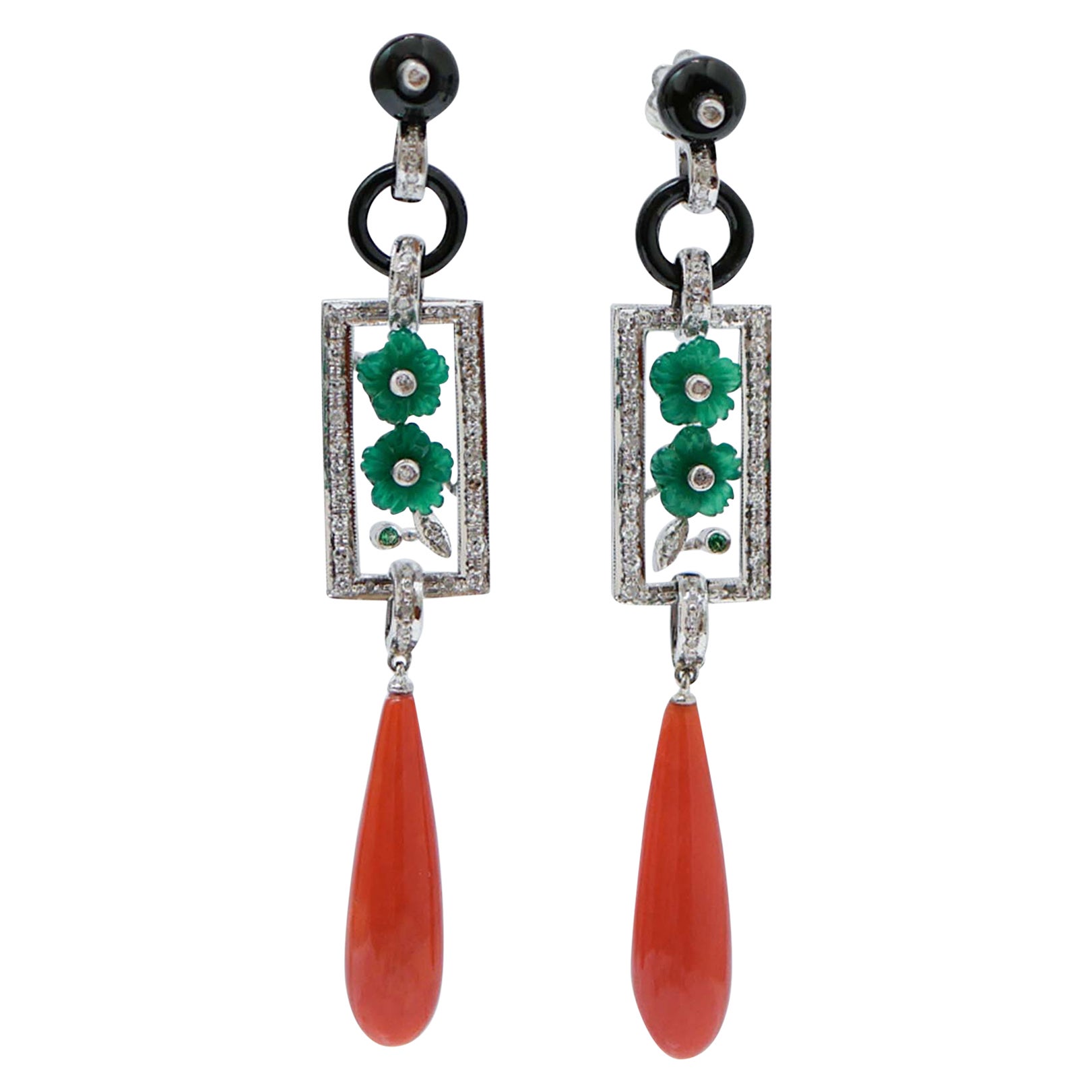 Ohrringe aus Platin mit Koralle, Onyx, Achat, Diamanten, Tsavorit und Platin.