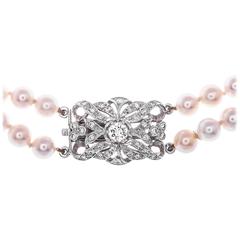 Edwardian Two-Strand Pearl 1.04 Carat Diamond and Gold Clasp Choker Necklace