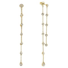 Pendientes colgantes de oro amarillo con diamantes por metros