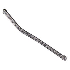 Bracciale tennis vintage retrò in platino con diamanti dal taglio transitorio