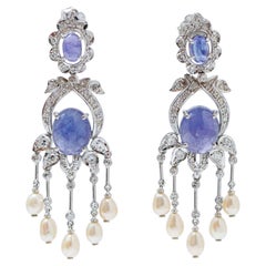 Tanzanite, perle, diamanti, orecchini di platino.