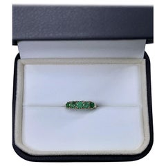 0.75ct Colombian green emerald eternity engagement ring 9ct yellow gold.