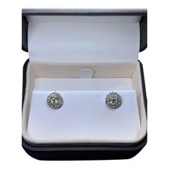 0.80ct Diamond halo solitaire stud earrings in 18k white gold.
