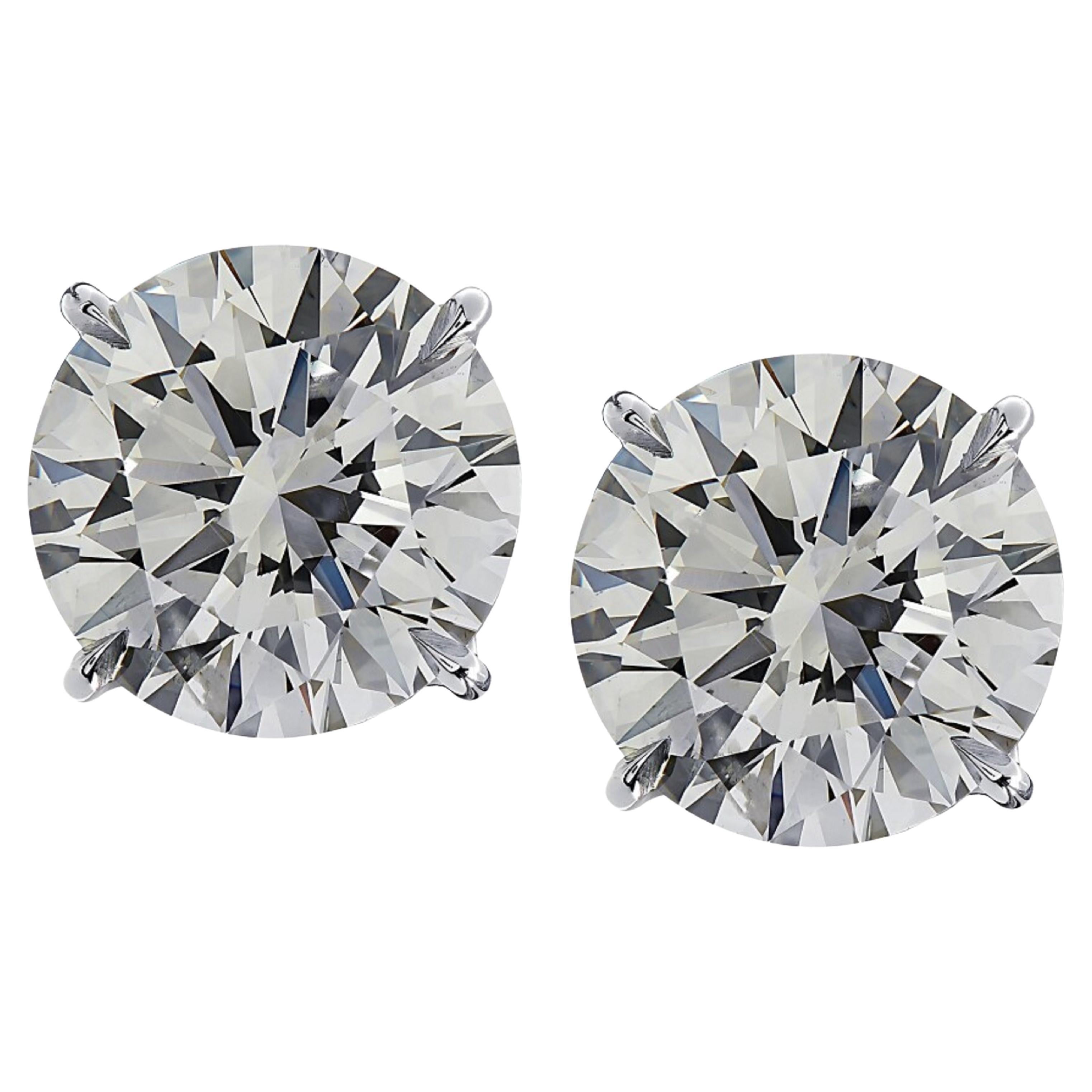 7.12 Carat Matched Pair of Round Cut Diamonds set in solid Platinum